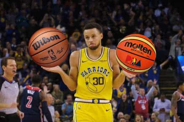 steph curry holding basketballs